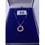 Superb 18t GOLD diamond and pink Sapphire? double ringed pendant set on a 18ct GOLD /m chain,