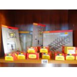 2 x shelves containing various boxed Hornby OO-Gauge buildings or buffer stoppers, un-used items and