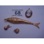 Decorative GOLD coloured fish, 4" long with articulated body, oval small cameo in GOLD coloured