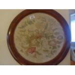 Pair of circular silk embroided pictures of flowers in original walnut frames 18" dia