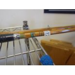 Old fishing rod, bamboo with makers label,