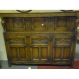 Good quality oak dresser with carved decoration throughout, the base section comprising 3 doors with