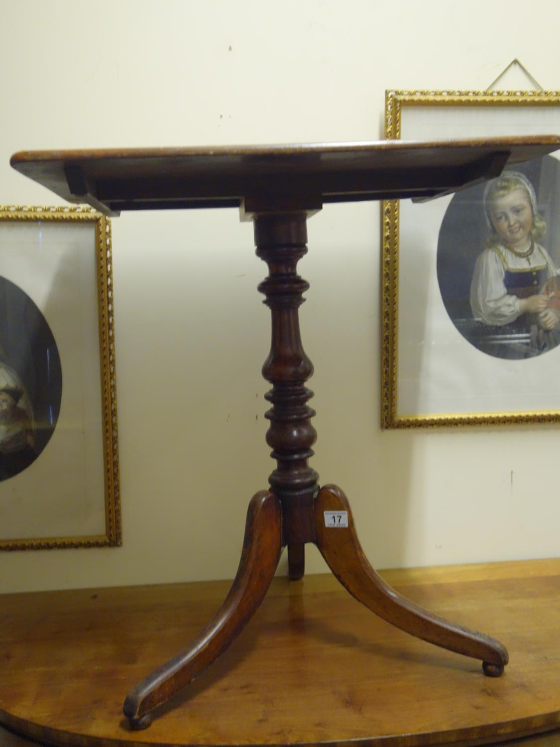 Georgian period tripod table with turned centre column above a rectangular top,