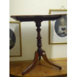 Georgian period tripod table with turned centre column above a rectangular top,