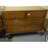 Early Georgian chest of 2 short and 2 long drawers, figurine walnut on pad feet with brass drop