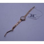 Ladies 9ct GOLD dress watch with 9ct GOLD strap, total weight 15 grams including movement, makers