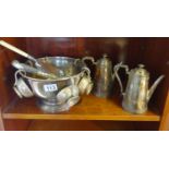 Shelf of silver plated items inclduing a punch bowl, cake server
