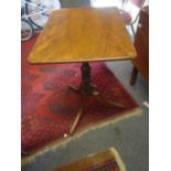 Georgian period tripod table with turned centre column above a rectangular top,