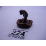 Small carved Netsuke of a Cobra Snake, 1.5" tall signed to base,