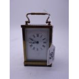 19th century small brass carriage clock with an 8 day movement 4" tall 2.5" wide with French
