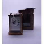 19th century brass carriage clock in leather carrying case, the movement marked with the engraved