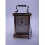 Brass Carriage Clock with key appears to be working 8 day French movement, with certificate from