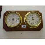 Ships reproduction Barometer and clock by Abbey, the clock has a quartz movement