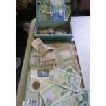 Tary containing 11 English £1 bank notes, various other old bank notes and a box of coins and