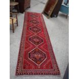 Burgundy coloured runner 10' long approx x 2' wide