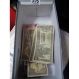 Box containing various old bank notes