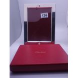 Cartier silver plated picture frame, 8.5" x 6" a box containing Cartier stationery, and a Bilston