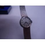 Ladies white 9ct gold Tissot wrist watch with matching 9ct gold bark strap, purchased 1982, with