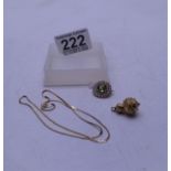 9ct gold Peridot and seed pearl pink 1/2" dia, a 9ct gold chain, and a gold coloured charm, total