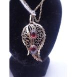 9ct gold pendant and chain, the pendant set with 2 x garnets total weight 7 grams