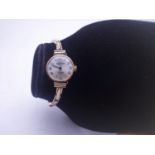 9ct gold cocktail watch with elasticated 9ct gold strap total weight 14 grams including movement est