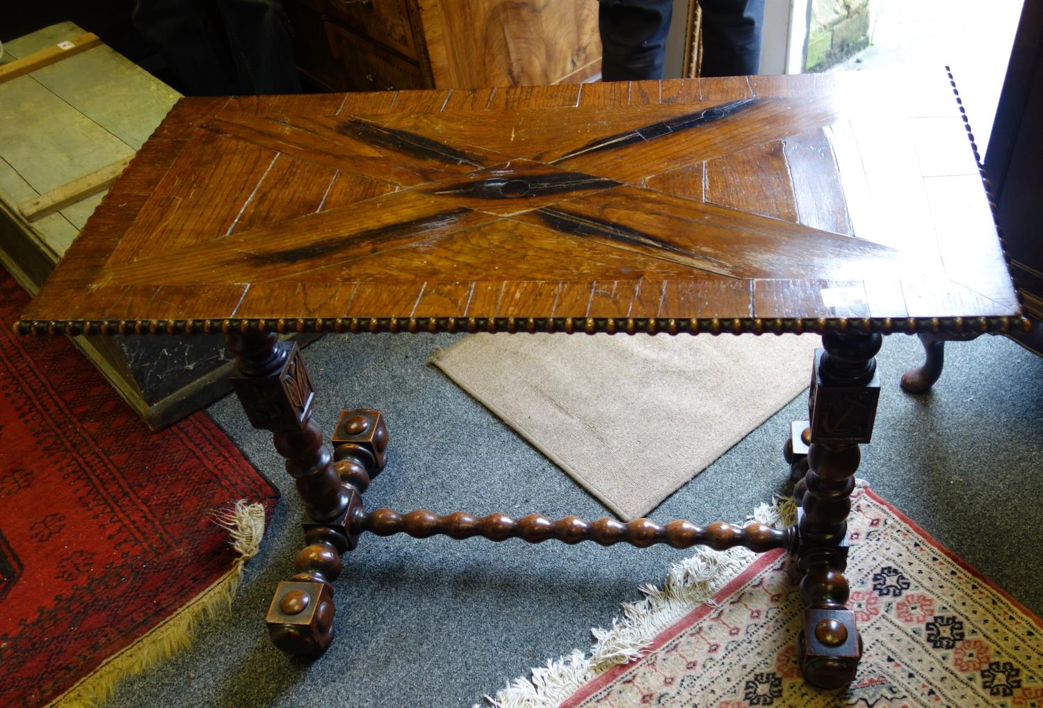 Nautical influenced 19th century sofa table with Marquerty design top above 2 columns each centre