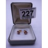 Pair of Diamond and Ruby stud earrings, set in 18ct gold un-worn
