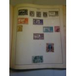 Strand stamp album with various stamps enclosed