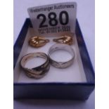 White gold wedding band a white coloured ring and a pair of gold earrings total weight 8 grams est