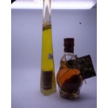 2 x Vintage bottles of Liquors a Malcolm Cowen Italian liquor un-opened and a single bottle of Poire