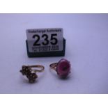 Amethyst set ring on 9ct gold shank size K, a garnet set 9ct gold ring, cross over section total
