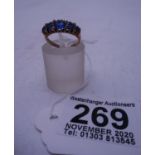 Ladies 9ct gold ring set with Blue stones , half hoop design