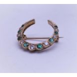 Stunning half crescent moon brooch set with DIAMOND s and emeralds, 7 DIAMOND s of graduating