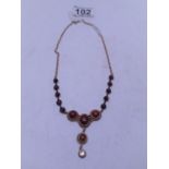 Superb ANTIQUE necklace, 15" long, predominately set with ruby coloured stones and a small DIAMOND