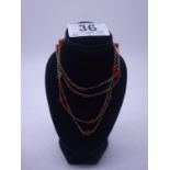 Delicate double strung 9ct GOLD necklace set with small coral beads, 20" long, 9 grams,