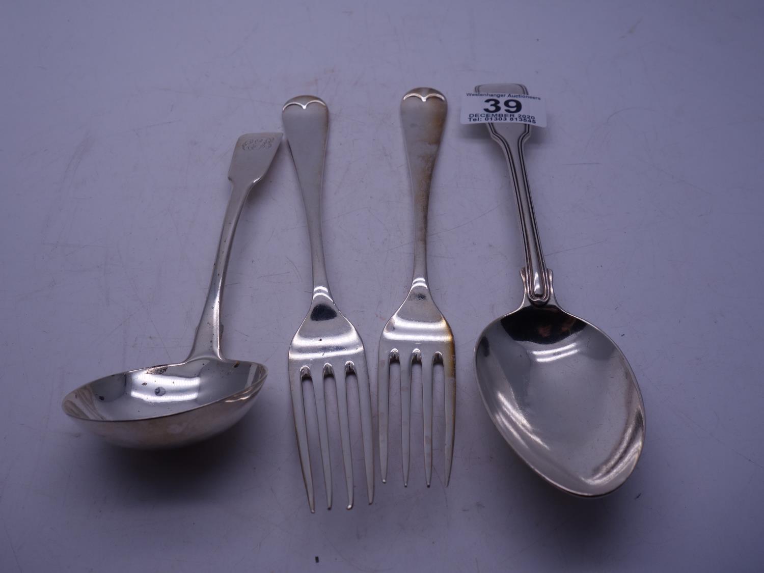 Pair of silver h/m 19c serving forks, a 19c serving spoon and a 19c silver h/m ladle, 300 grams