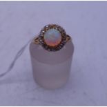 Ladies fiery opal and DIAMOND cluster ring the centre opal 1.5ct approx surrounded by DIAMOND s,