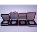 4 x silver commemorative coins in proof condition and collectors capsule