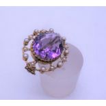 VICTORIAN period natural Amethyst oval brooch set with seed pearls, large stone to the centre,