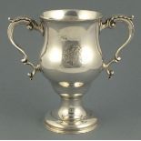 A George III silver twin handled cup, London 1772, Walter Brind, of bellied form with leaf capped