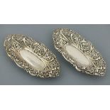 A pair of silver bonbon dishes, Birmingham 1893, of oval form with pierced foliate decoration, 171.