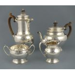 A matched four piece silver tea service, London 1954-60, Edward Barnard & Sons, with a bullet shaped