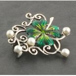 A silver and enamel brooch, modelled in the form of a clover leaf and set with pearls, 7cm