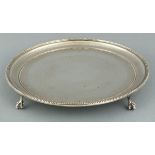 A Victorian silver salver, London 1867, Joseph Edward Bradbury, circular with bright-cut engraving