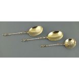 A pair of Victorian silver apostle serving spoons, London 1897, William Hutton, with gilt bowls