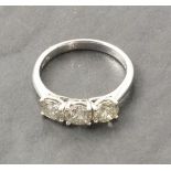 An 18ct white gold three stone diamond ring, total diamond carat weight 1.60ct