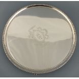 A George III silver salver, London 1787, Elizabeth Jones, circular with a bright-cut swagged