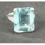 An aquamarine and diamond dress ring, the emerald cut central stone, 19ct, with diamond set