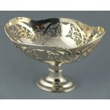 An Edwardian silver fruit bowl, Sheffield 1910, Daniel George Collins, the oval pierced bowl above a