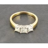 An 18ct yellow and white gold princess cut diamond trilogy ring, diamonds 1.00ct
